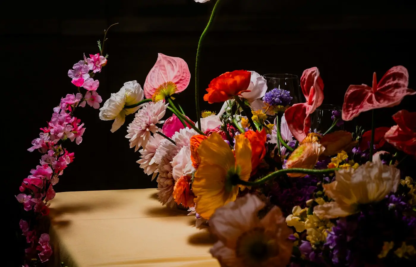 A table set under a floral arch